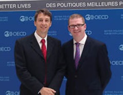 Finance Minister Simon Hamilton is pictured at the OECD headquarters in Paris with its UK Ambassador NIck Bridge