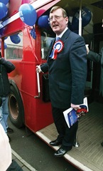 David Trimble alights a London bus at the UUP manifesto launch,