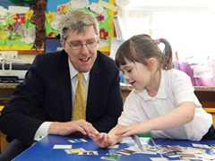 O’Dowd discusses shared education during a visit to Fermanagh
Education Minister, John O’Dowd, today visited Fermanagh where he met with representatives from the Fermanagh Trust before visiting two schools in the area.
During the first part of the day the Minister met with the Fermanagh Trust and Principals from local primary schools who are participating in the ‘Shared Education’ Programme.
The Minister heard of the successes and challenges of shared education in Fermanagh and had the opportunity to discuss the Department’s position on shared education going forward.  

From here the  Minister visited Bunscoil an Traonaigh in Lisnaskea where he met with the Principal and pupils, followed by a tour of the school.  
Concluding official business in Fermanagh, the Minister visited St Mary’s Primary School, Newtownbutler where he attended a ‘Families and Schools Together’ graduation ceremony which is managed by ‘Save the Children’.

Pictured with the Minister is Clodagh Flynn from the Bunscoil an Traonaigh in Lisnaskea.  Photo M T Hurson/Harrisons