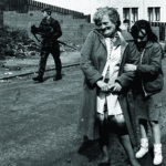 Grandmother and grandaughter pose during a bombscare in Ballymurphy, West Belfast in 1986.