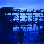 A burnt-out bus on the Falls Road in 1986