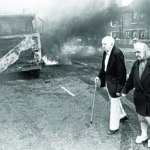 An older couple cross debris during riots after the early parole release of Lee Clegg, a soldier convicted of murder, in 1995.