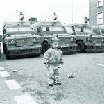 A child is pictured during a security lock in on the Ormeau Road during the passing of an Orange Order parade in 1996.