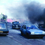 A funeral avoiding riot debris in 1981
